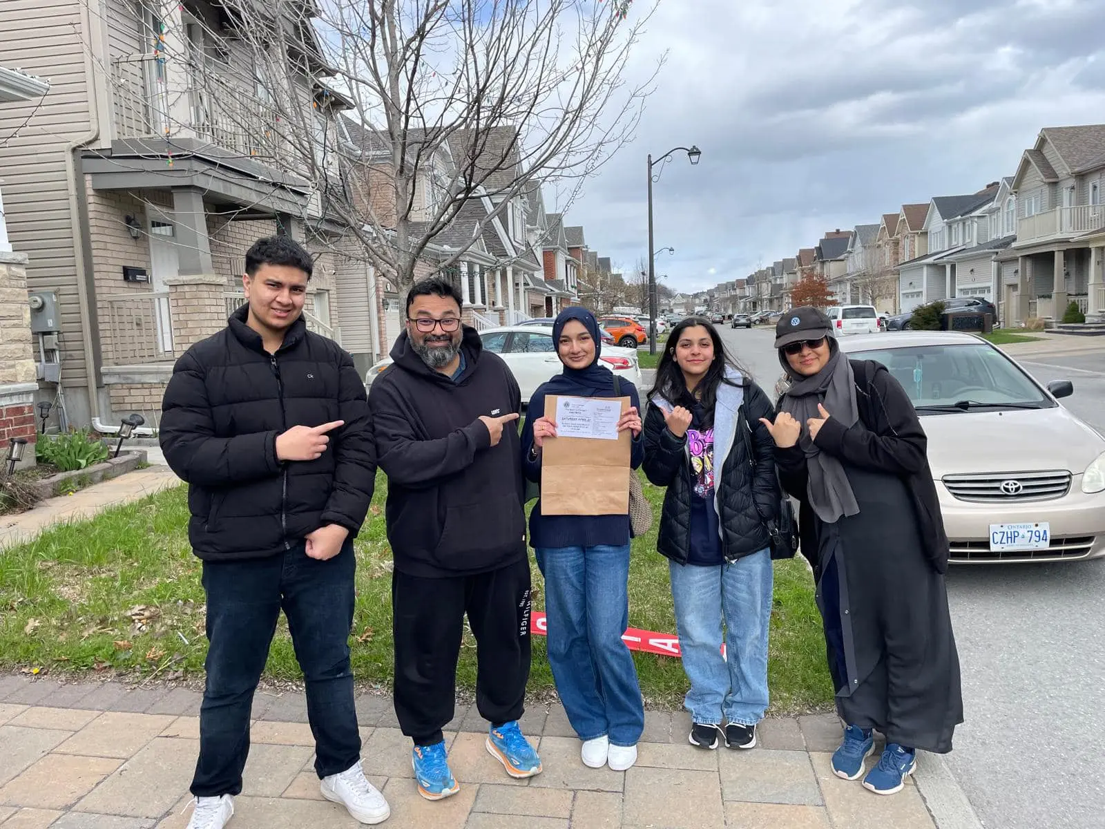 volunteer group photo in driveway