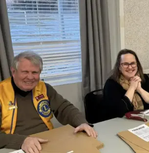 volunteers sitting at a table